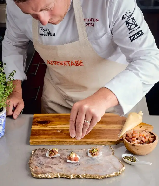 chef preparing dish restaurant kitchen Algarve