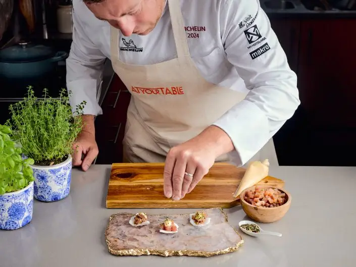 chef preparing dish restaurant kitchen Algarve