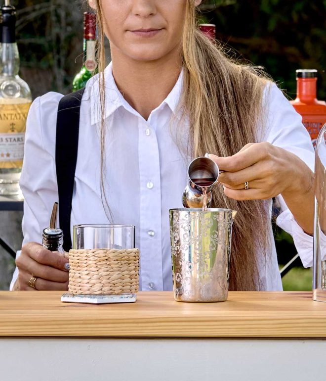 Bartender preparing a cocktail outdoor at a bar Algarve Portugal