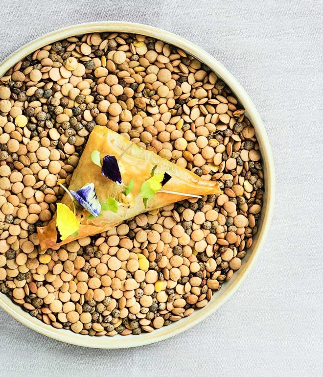 Samosa with garnishes on lentils on a table Algarve Portugal