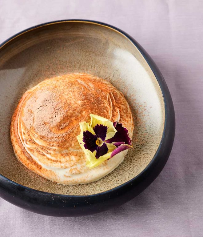 Dessert with flower as garnish in a bowl on the table Algarve Portugal