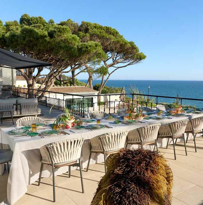 Private dining- table being prepared outside villa Algarve Portugal