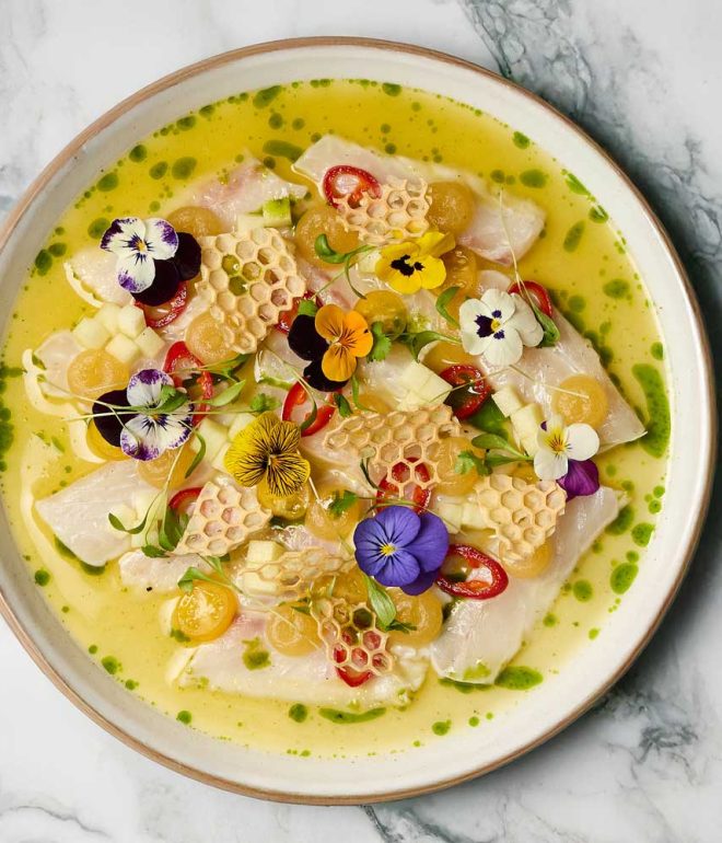 Fish ceviche with dressing in a plate on a table Algarve Portugal