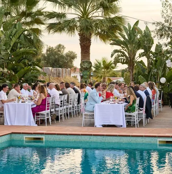 Guests eating at the table outside the villa algarve Portugal