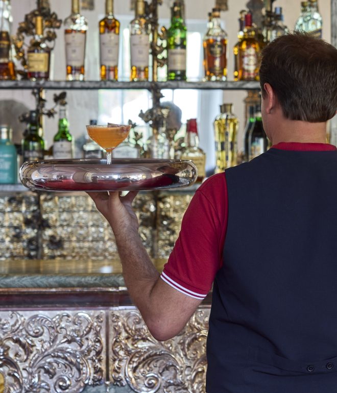 Waiter holding cocktail