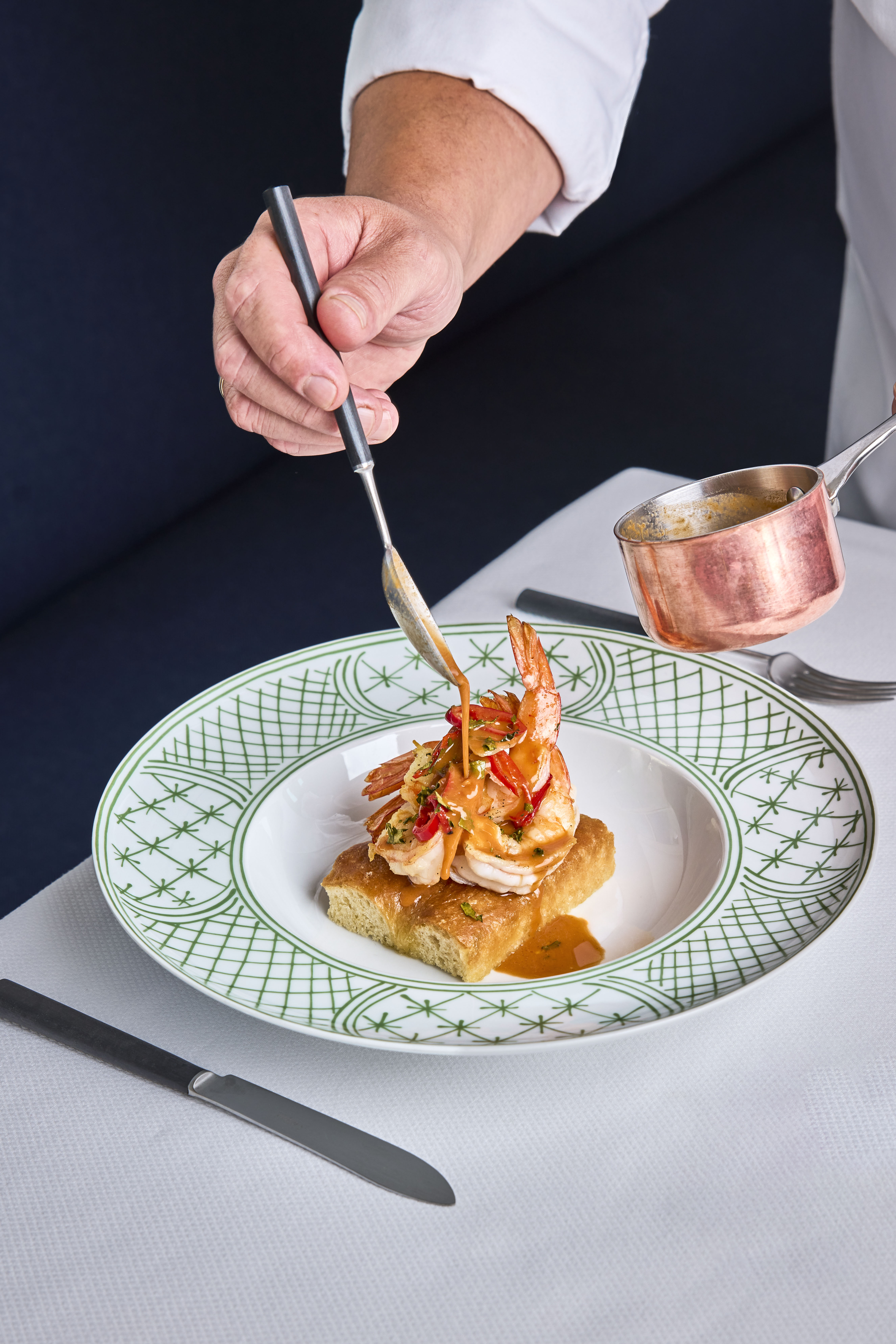 Chef finishing to plate on colourful Plate, Vermelho, Portugal