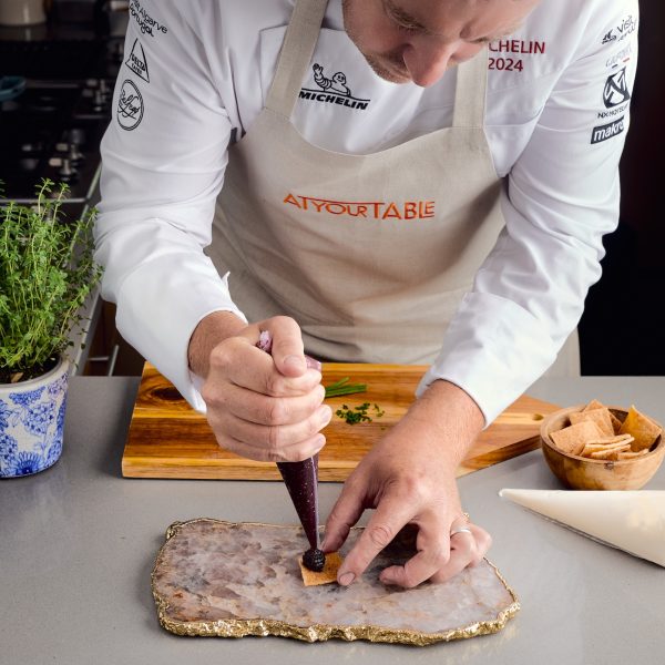 chef prepping canapes on platter