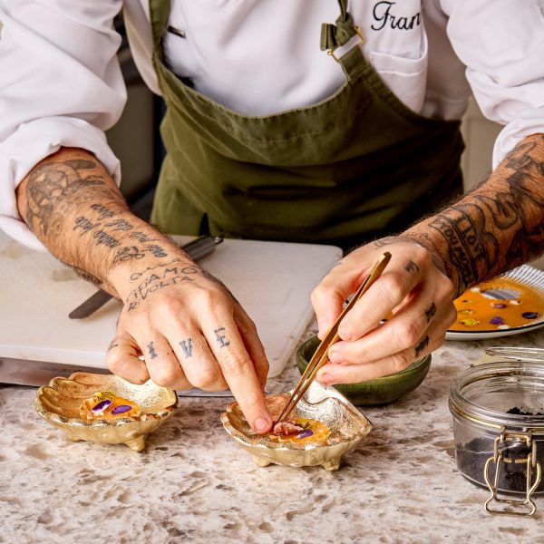 chef garnishing canapes