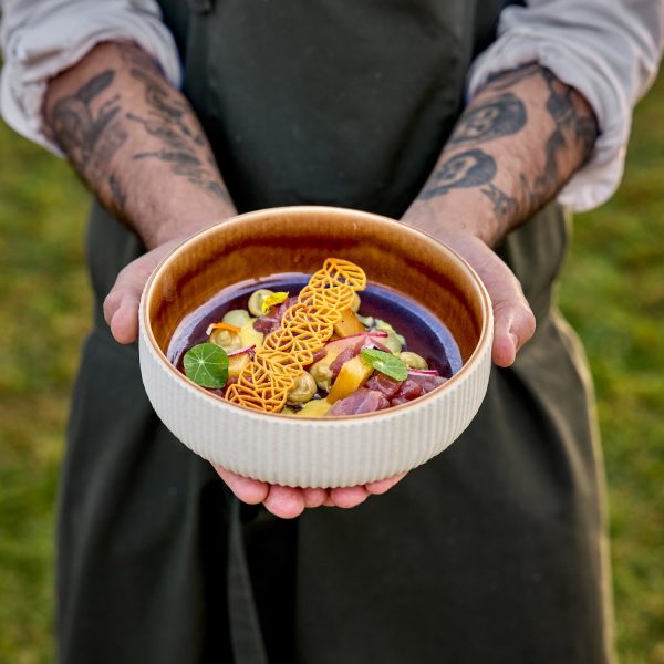 chef holding a plate
