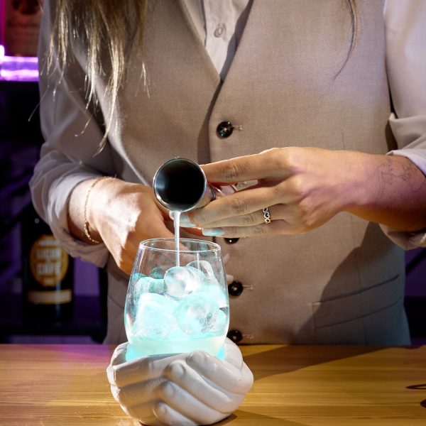 cocktail being prepared by bartender
