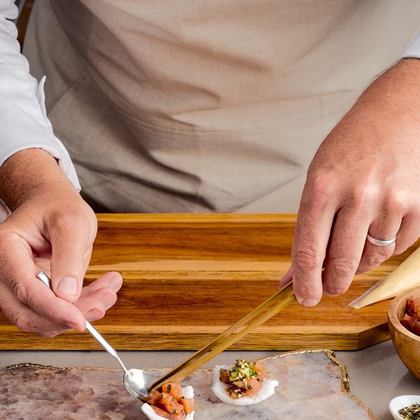 chef prepping canapes on platter