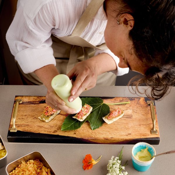 Chef preparing food on a wooden board